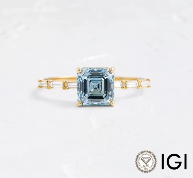 asscher cut blue lab-grown diamond ring in 9k yellow gold – 2.0 ct with baguette side diamonds