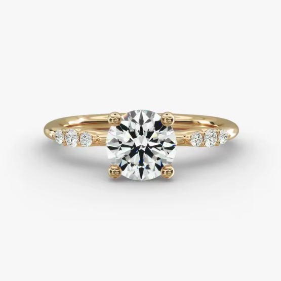 Gold ring with a diamond on a white background