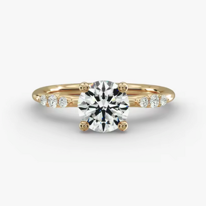 Gold ring with a diamond on a white background